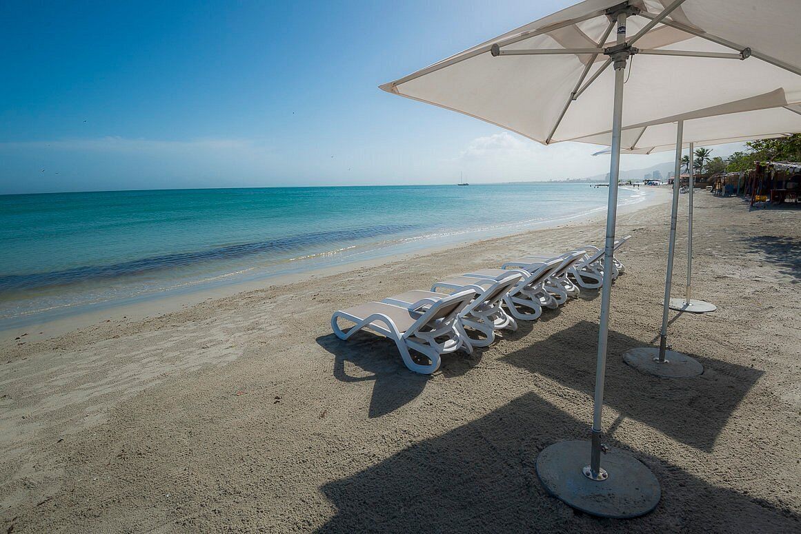 Private beach, white sand, sun loungers, beach umbrellas