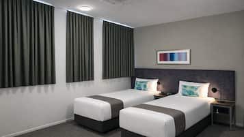 Premium bedding, desk, laptop workspace, soundproofing