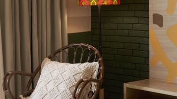 A wicker chair with a textured cushion, a floor lamp with a patterned lampshade, and a brick wall.