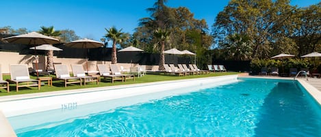 Indoor pool, seasonal outdoor pool, pool umbrellas, pool loungers