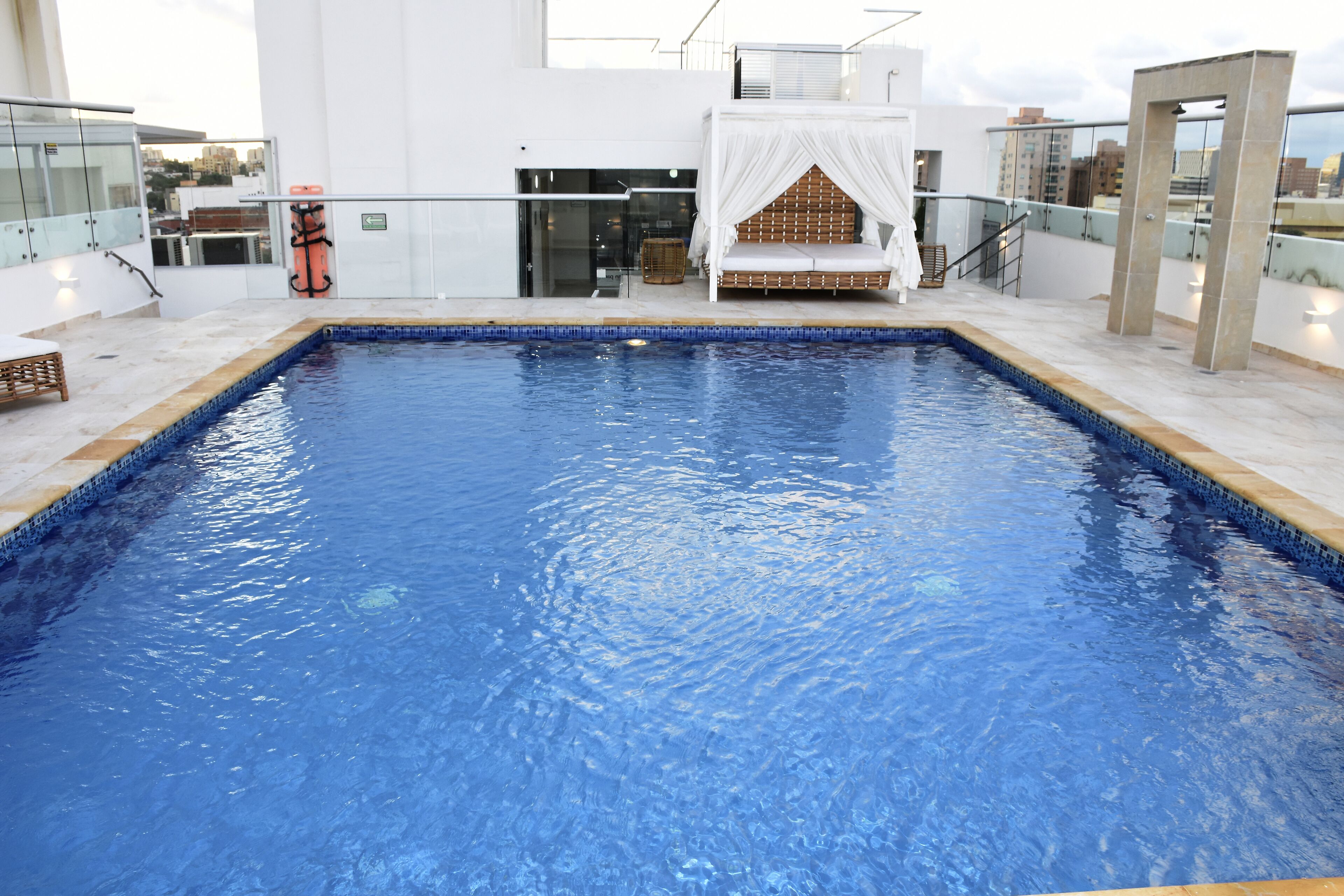 outdoor pool, open 10:00 am to 6:00 pm, pool loungers