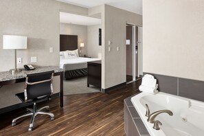 Premium bedding, desk, laptop workspace, blackout drapes