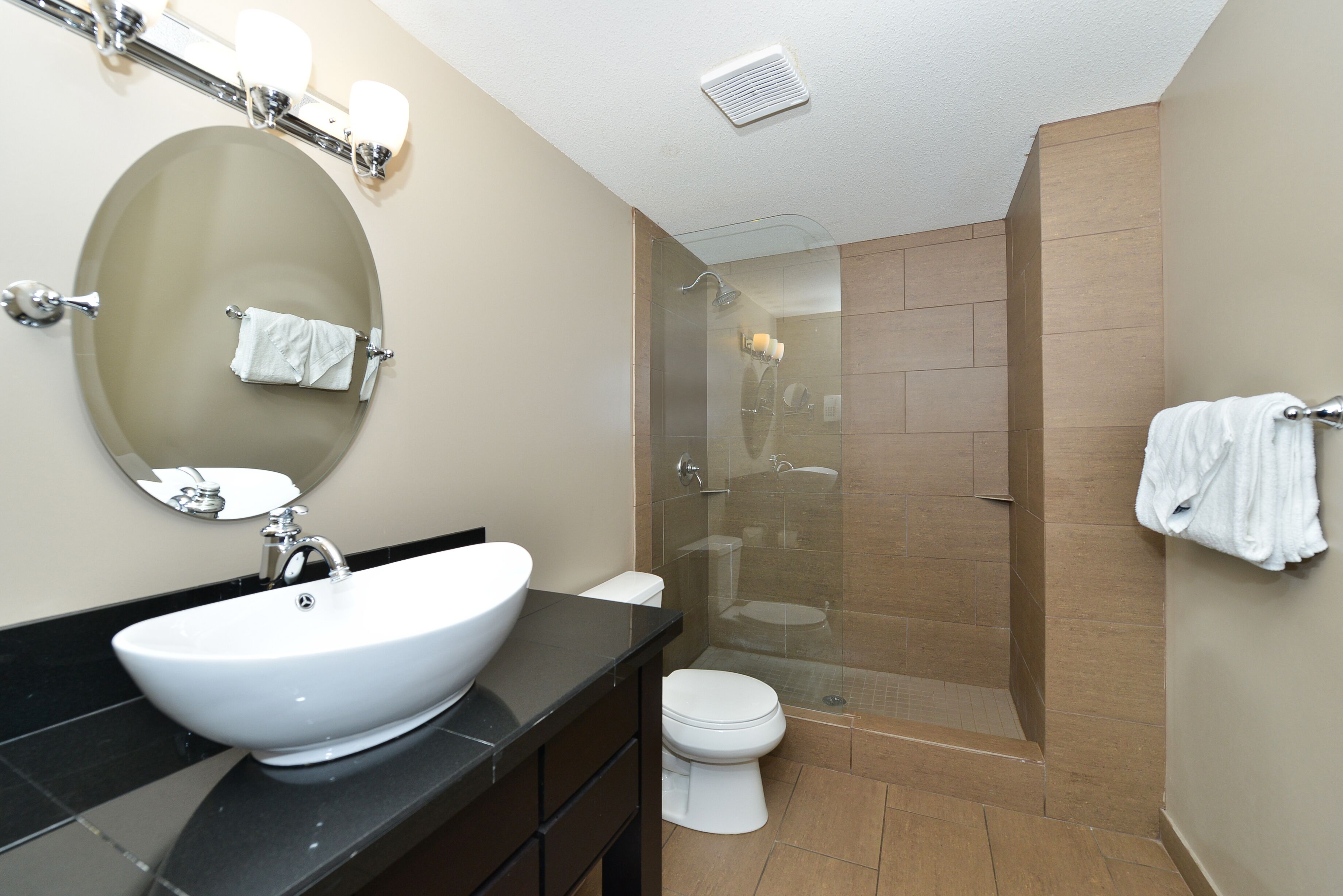 designer toiletries, hair dryer, towels