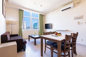One Bedroom Deluxe | Living area | 32-inch LED TV with cable channels, TV