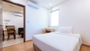 Two Bedroom Deluxe | Minibar, in-room safe, desk, blackout curtains