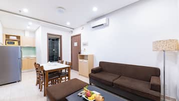 Two Bedroom Deluxe | Living area | 32-inch LED TV with cable channels, TV
