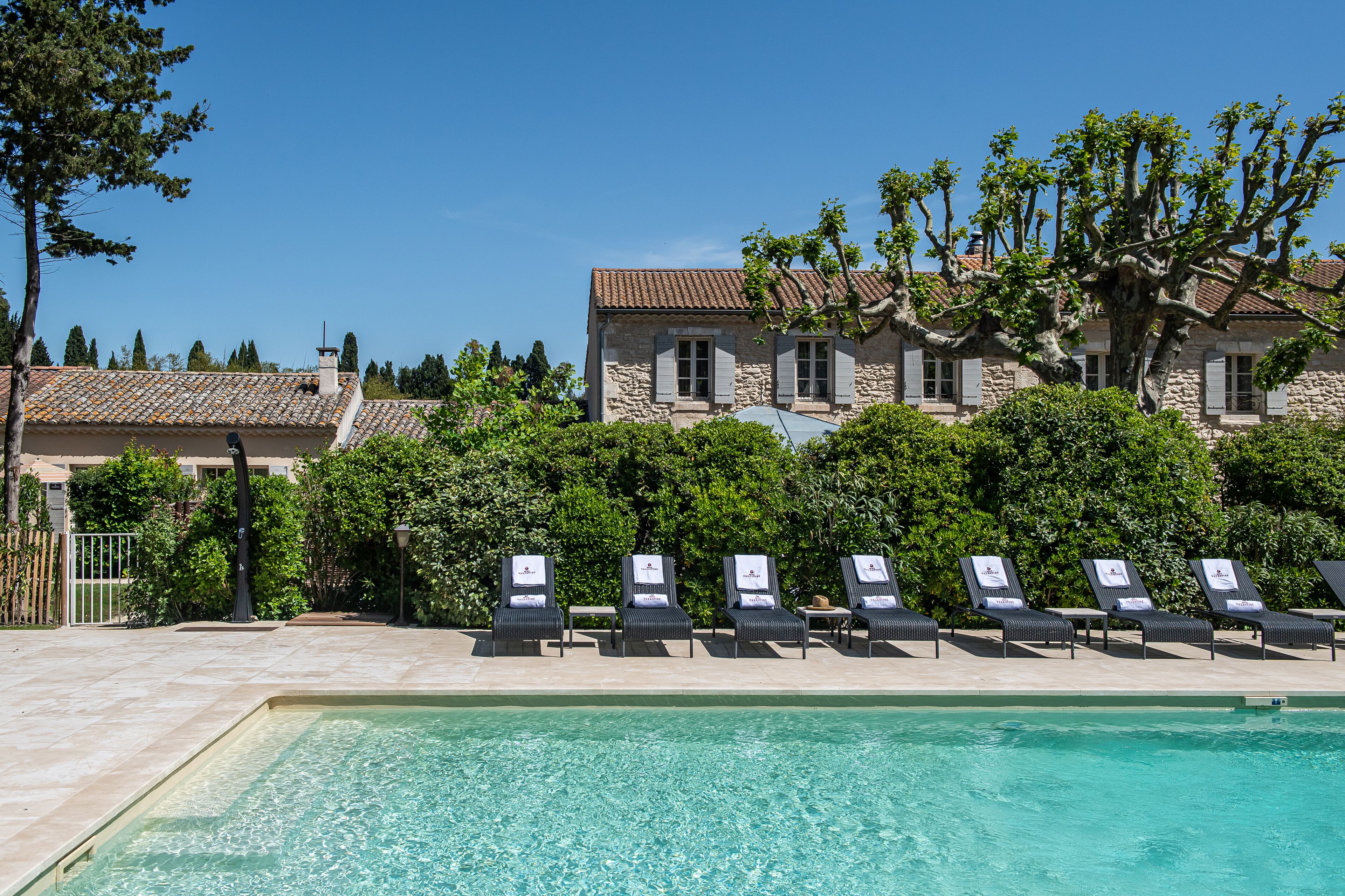 seasonal outdoor pool, pool umbrellas, pool loungers