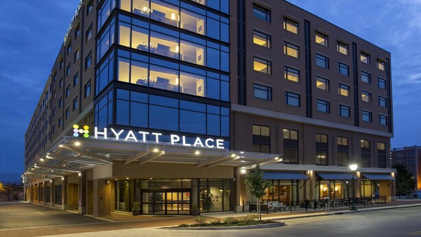 A multi-story hotel with a glass facade and a prominent 'Hyatt Place' sign. - Hyatt Place Bloomington (Bloomington)