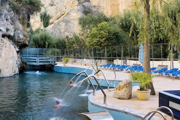 Outdoor pool, open 10:00 AM to 8:00 PM, pool loungers