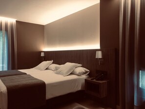 Premium bedding, down duvets, in-room safe, individually decorated