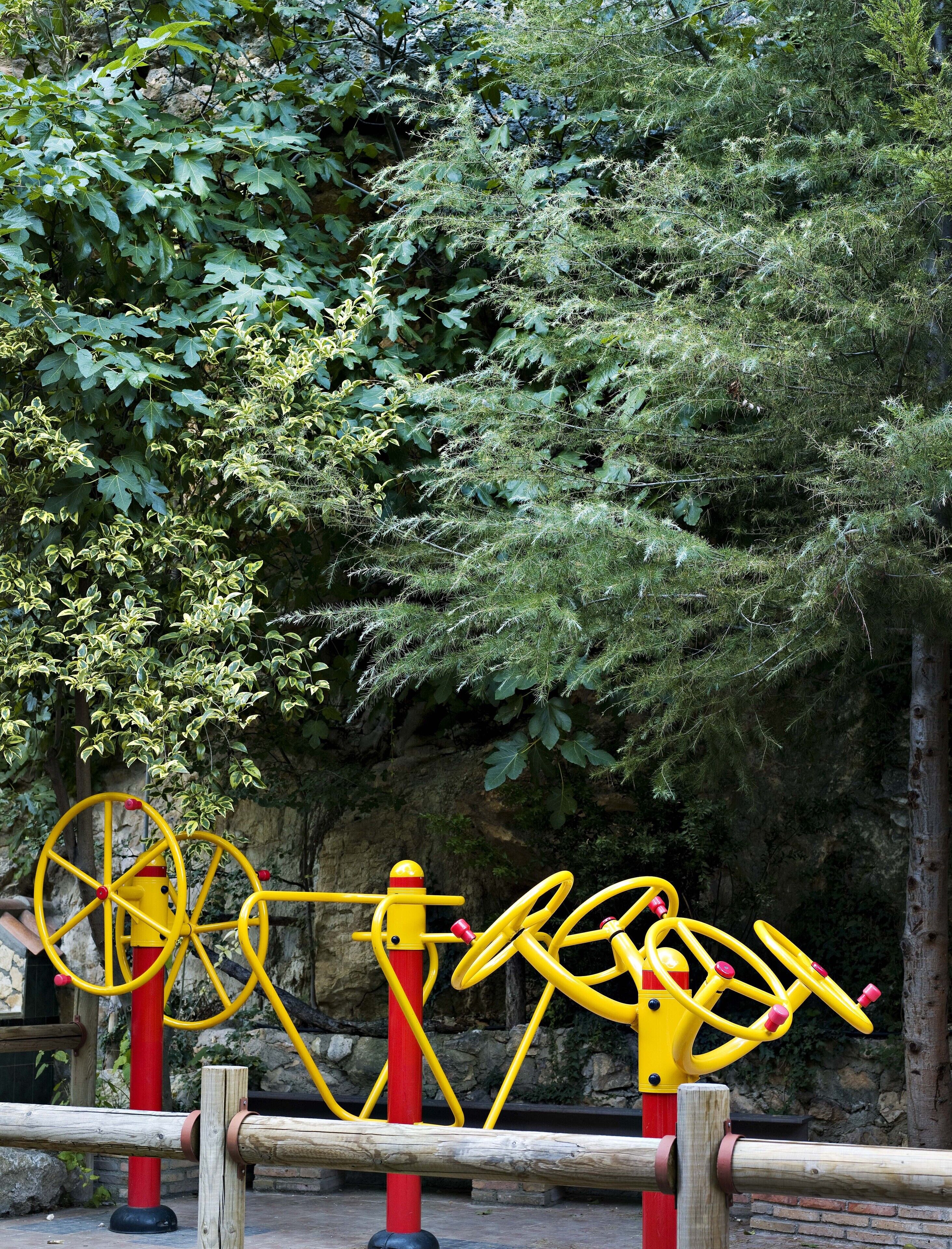 Outdoor exercise equipment with a natural backdrop.
