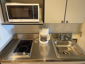 Fridge, microwave, stovetop, coffee/tea maker