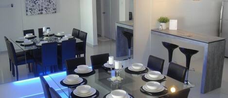 Full-size fridge, stovetop, electric kettle, cookware/dishes/utensils