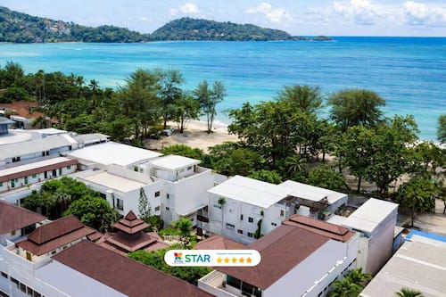 Beach nearby, white sand, beach umbrellas, beach towels