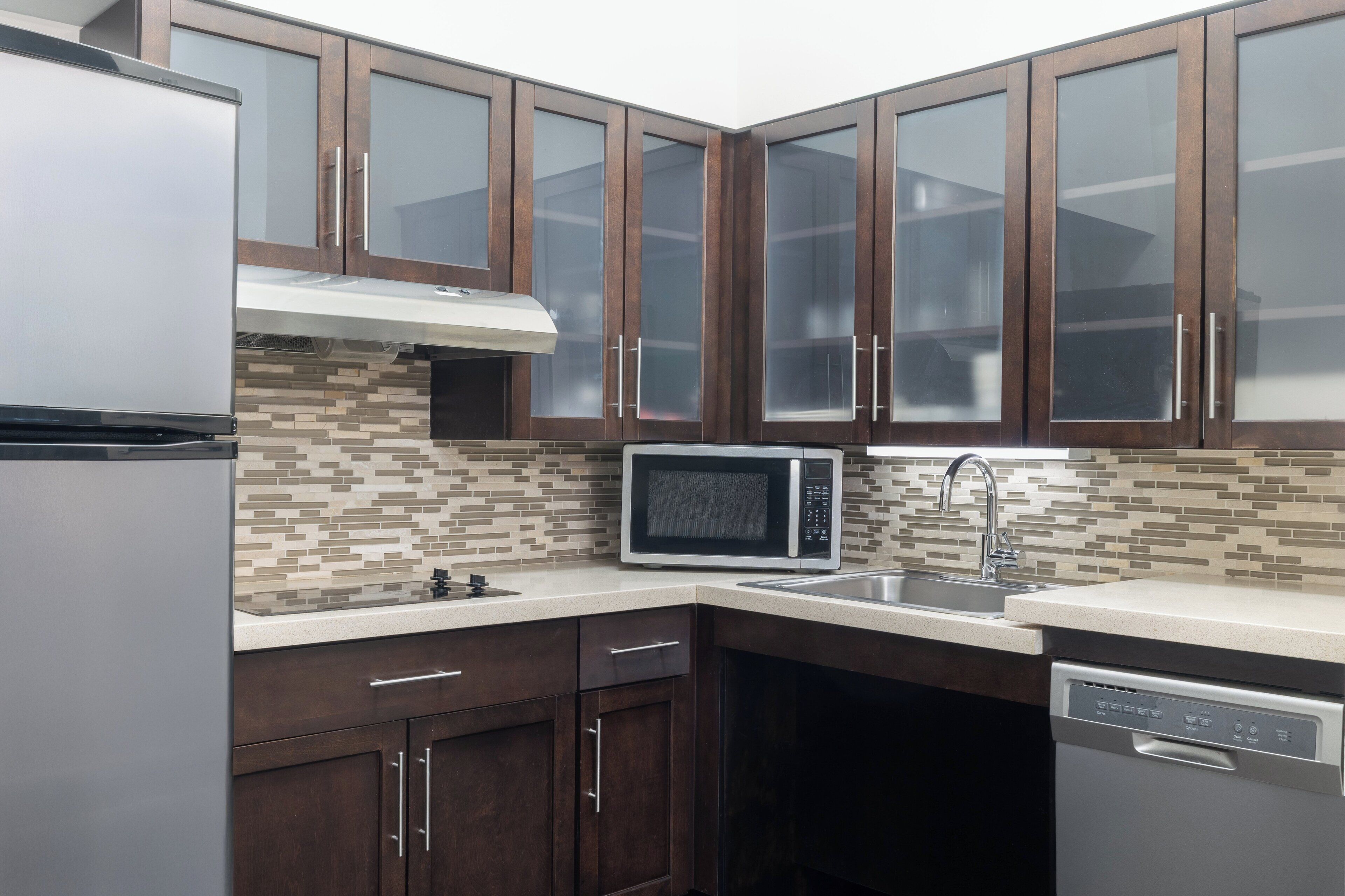 full-sized fridge, microwave, stovetop, dishwasher