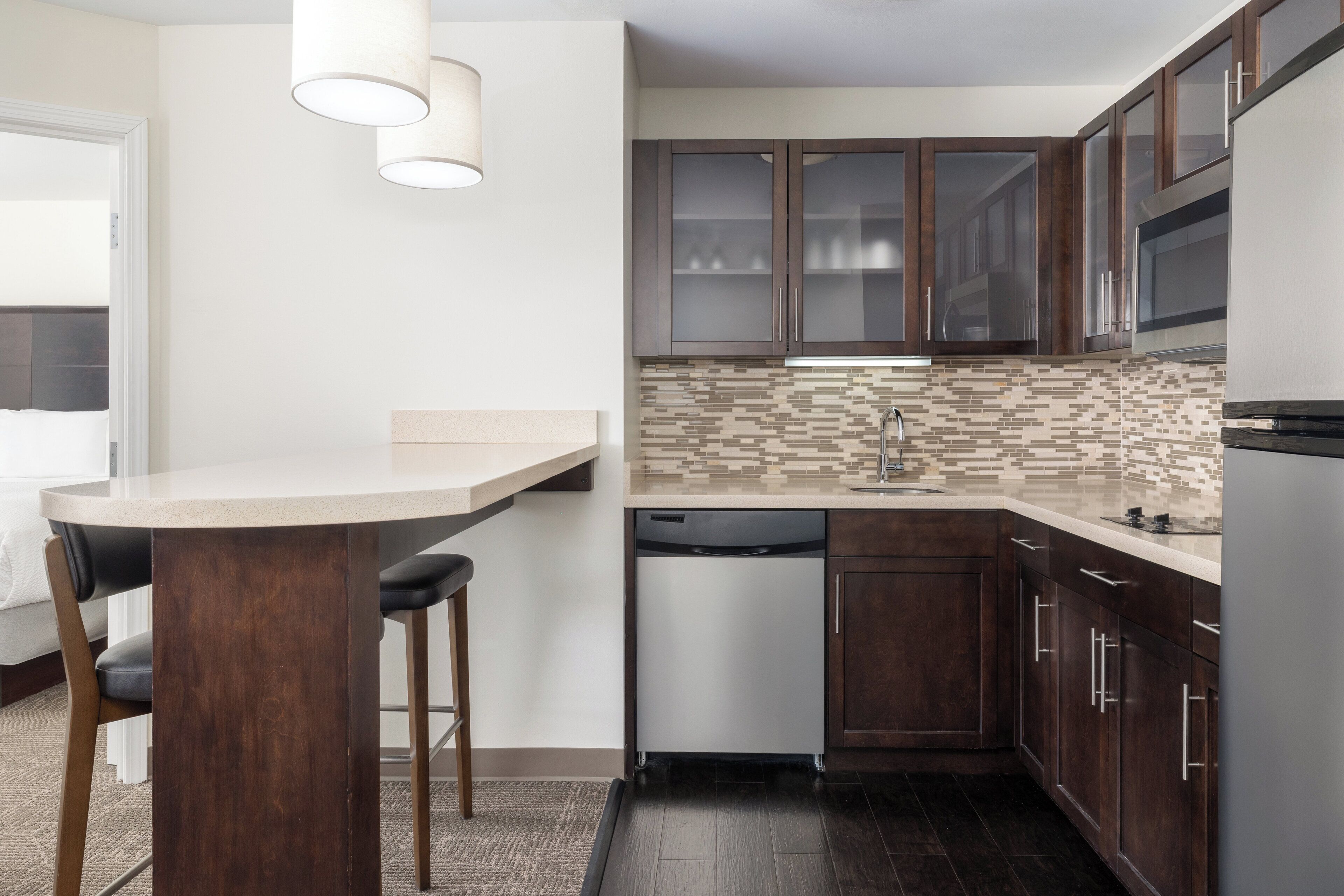 full-sized fridge, microwave, stovetop, dishwasher