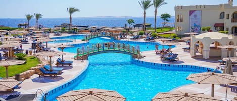 Outdoor pool, pool umbrellas, sun loungers