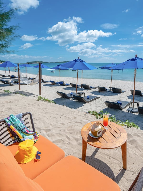 On the beach, sun loungers, beach umbrellas, beach towels