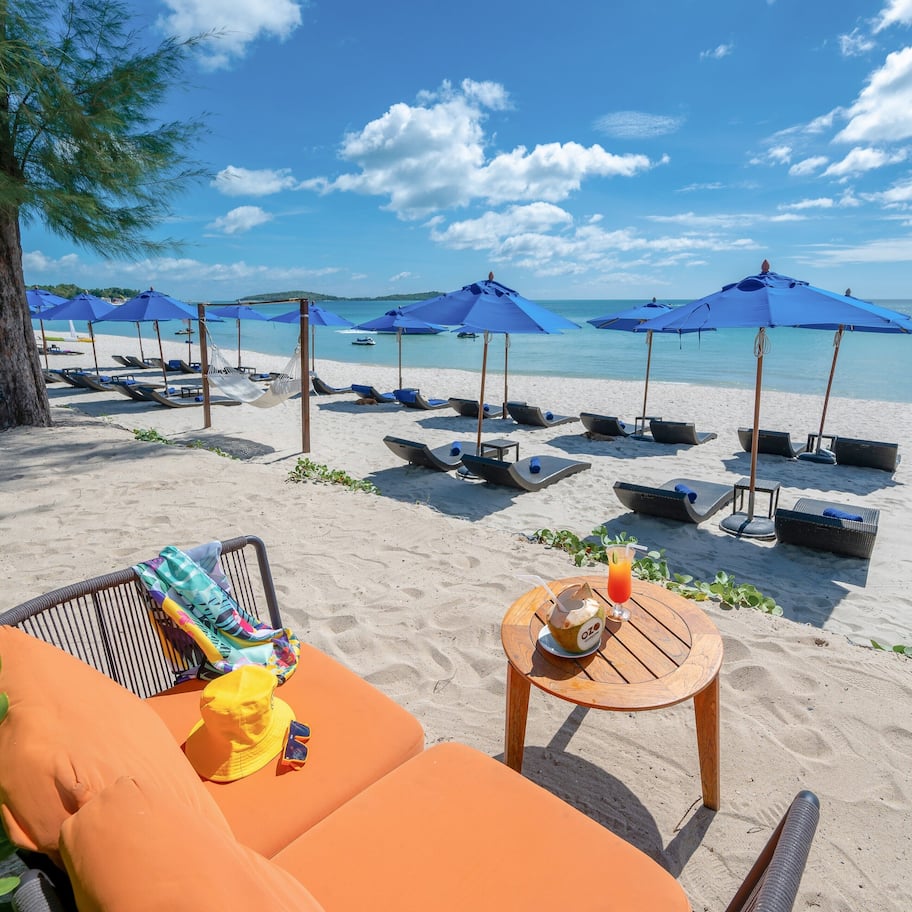 On the beach, sun loungers, beach umbrellas, beach towels