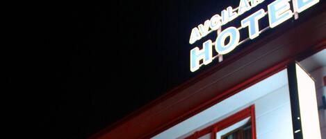 A hotel building with a sign reading "AVCILAR HOTEL" at the top.