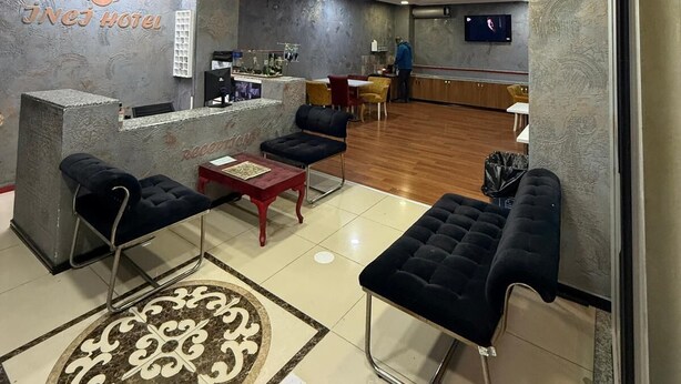 A hotel lobby with a reception desk, seating area, and a bar. - Avcilar Inci Hotel (Istanbul)