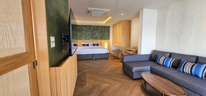 Beach Front Suite with One Way Airport Transfer | Living area | 45-inch LCD TV with satellite channels - Punnpreeda Beach Resort (Koh Samui)