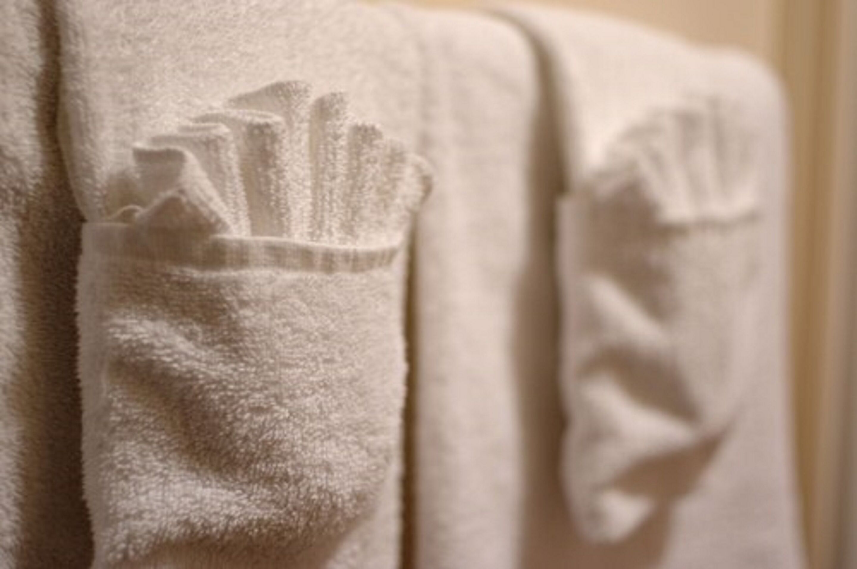 A white towel with a cityscape design.