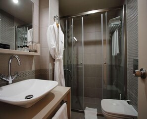 Deep soaking tub, hydromassage showerhead, free toiletries, bathrobes