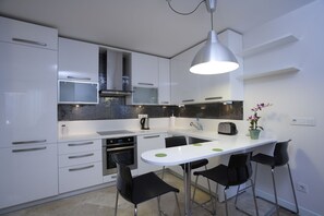 Fridge, microwave, stovetop, coffee/tea maker