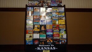 A display of travel guides and maps for Kansas. - Wyatt Earp Hotel (Dodge City)