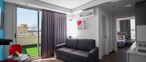 Premium Double Room, Kitchenette | Minibar, in-room safe, desk, blackout curtains