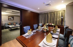 Al Noor Suite | Living area | 32-inch LCD TV with satellite channels, TV - Al Aqeeq Hotel Madinah ex. Millennium (Madinah)