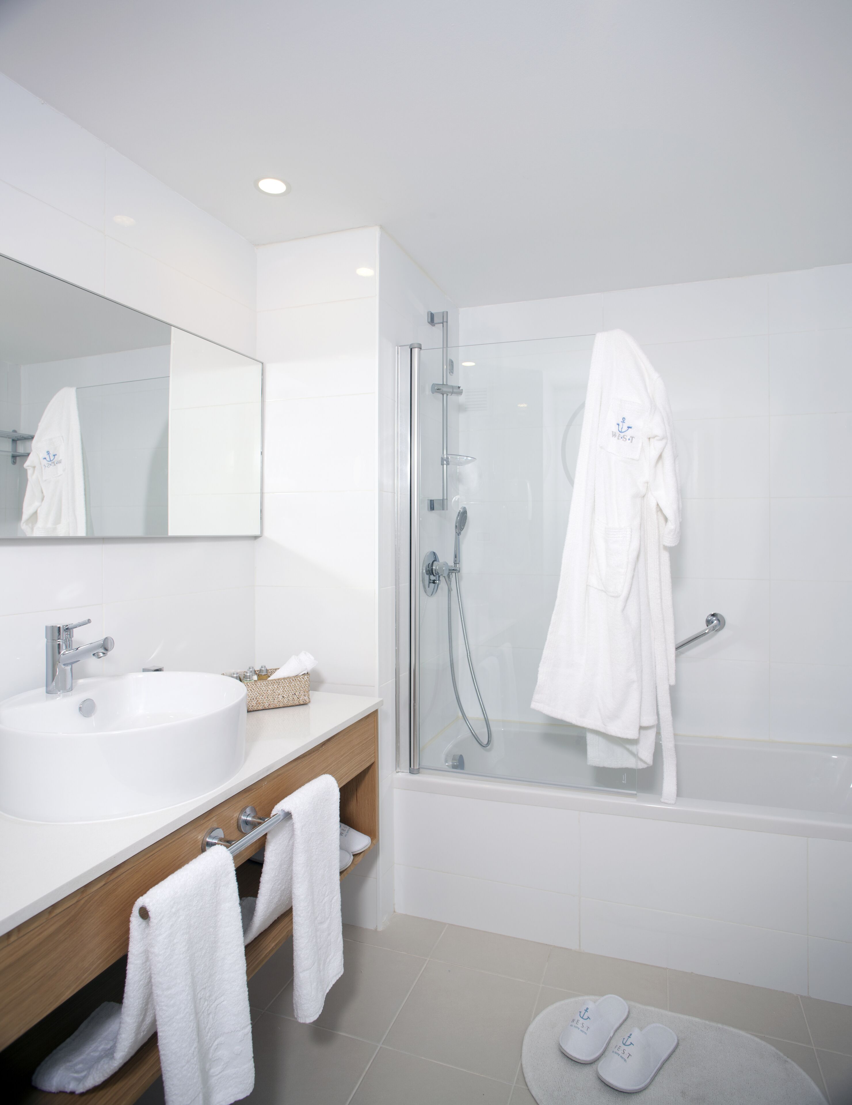 bathtub, slippers, towels