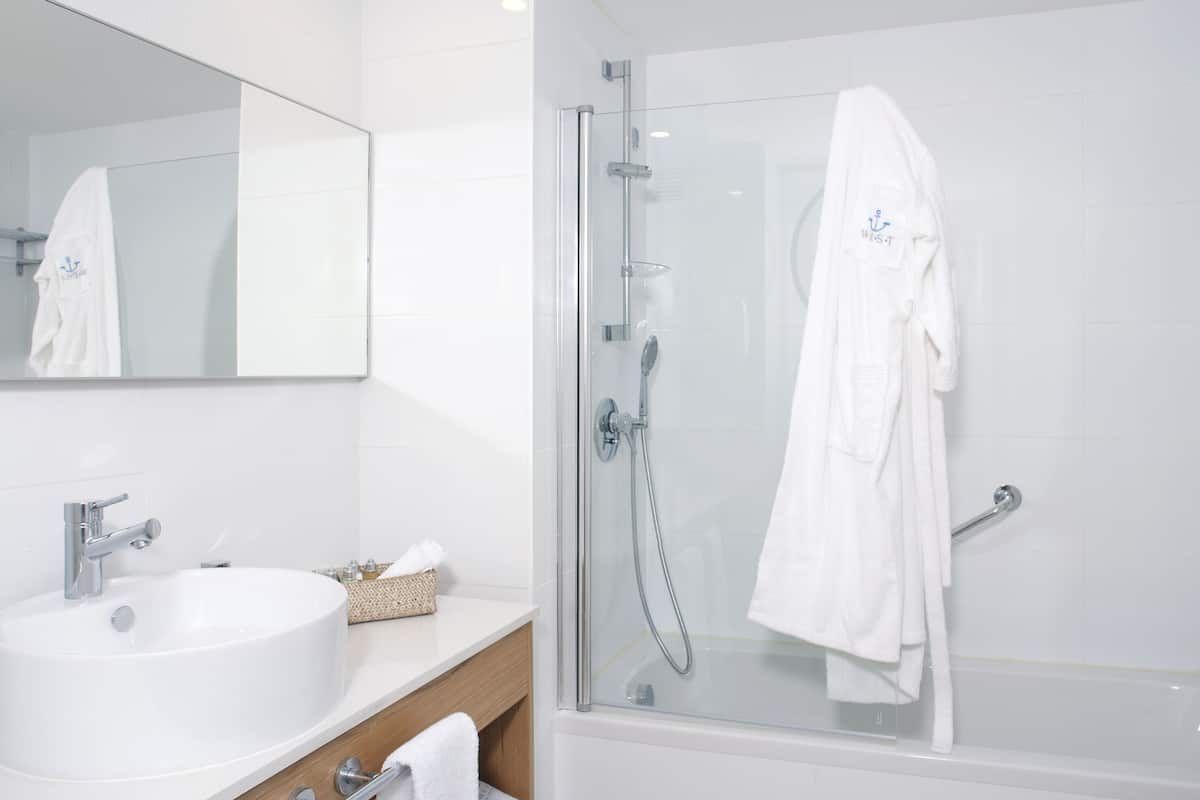 bathtub, slippers, towels