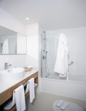 Bathtub, slippers, towels