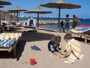 Private beach, beach umbrellas, beach towels, beach massages