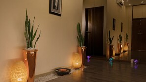 A modern hotel lobby with wooden flooring, potted plants, and ambient lighting. - Best Western Green Hill Hotel (Yangon)