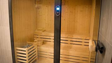 A sauna with wooden walls and a bench.