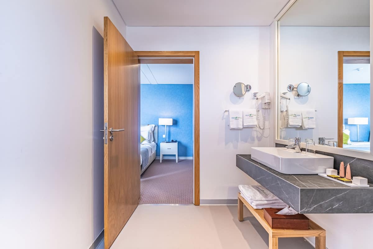 twin room | bathroom | rainfall showerhead, free toiletries, hair dryer, bathrobes