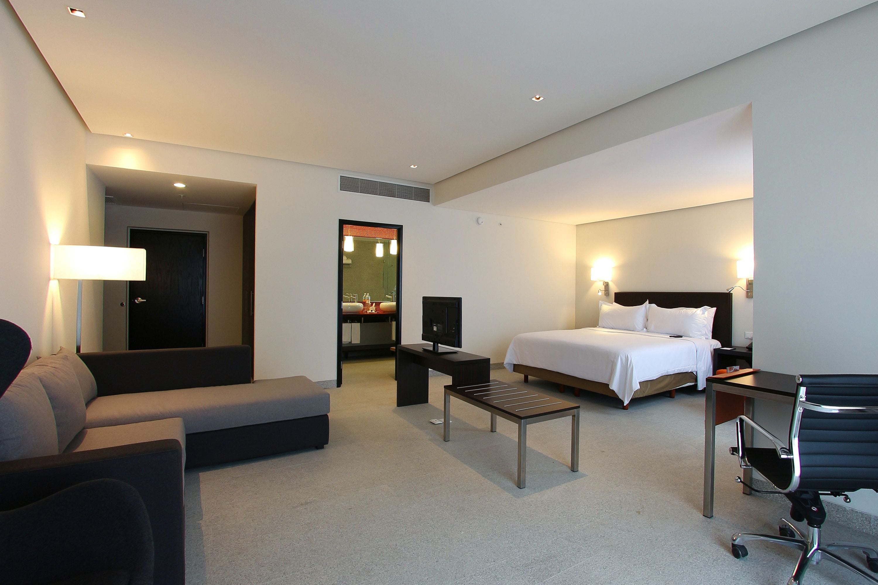 junior suite, 1 king bed | in-room safe, desk, laptop workspace, blackout curtains