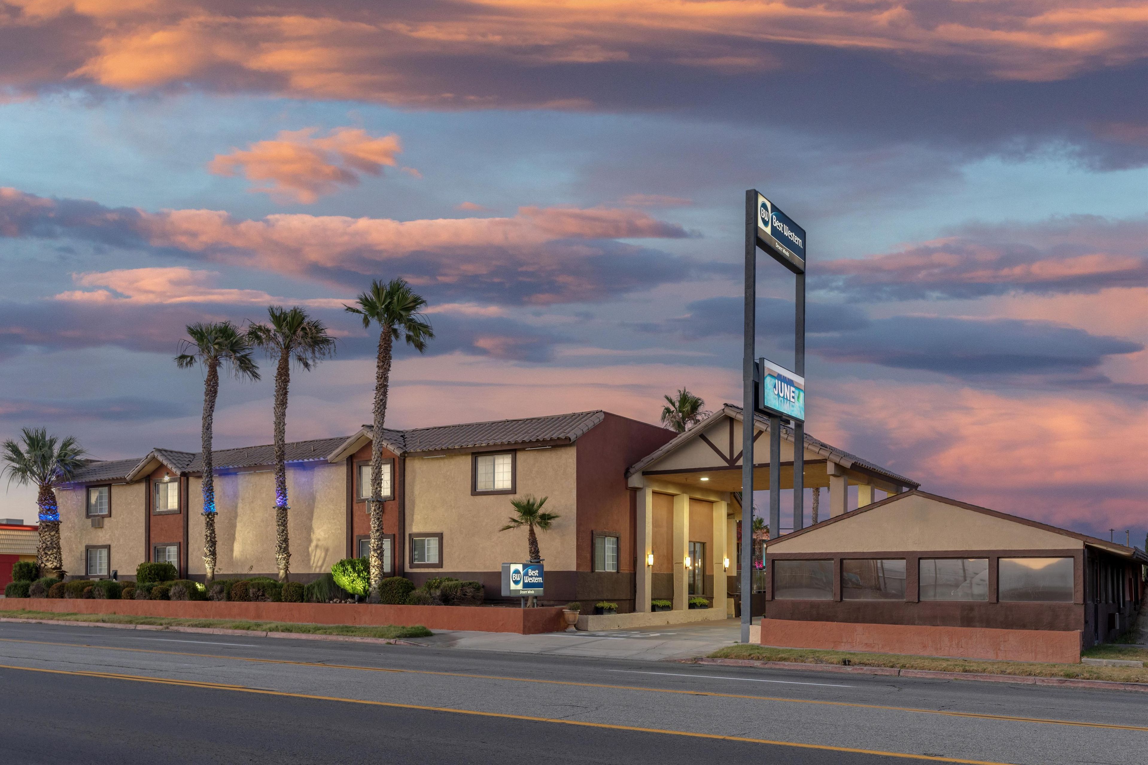 A hotel with a sign indicating it is a Best Western property.