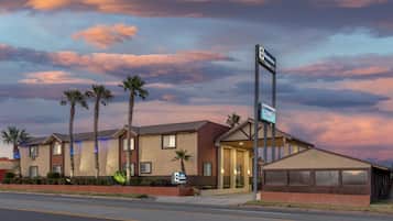 A hotel with a sign indicating it is a Best Western property.