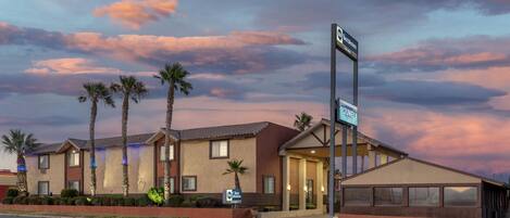 A hotel with a sign indicating it is a Best Western property.
