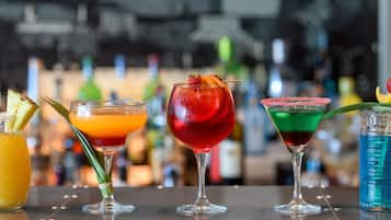A bar with various colorful cocktails.
