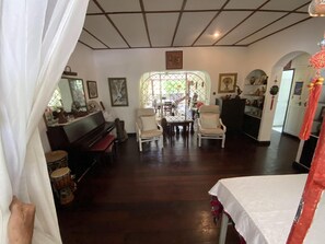 Comfort Apartment, 4 Bedrooms (The Hummingbird Apartment) | Living area | LED TV, DVD player