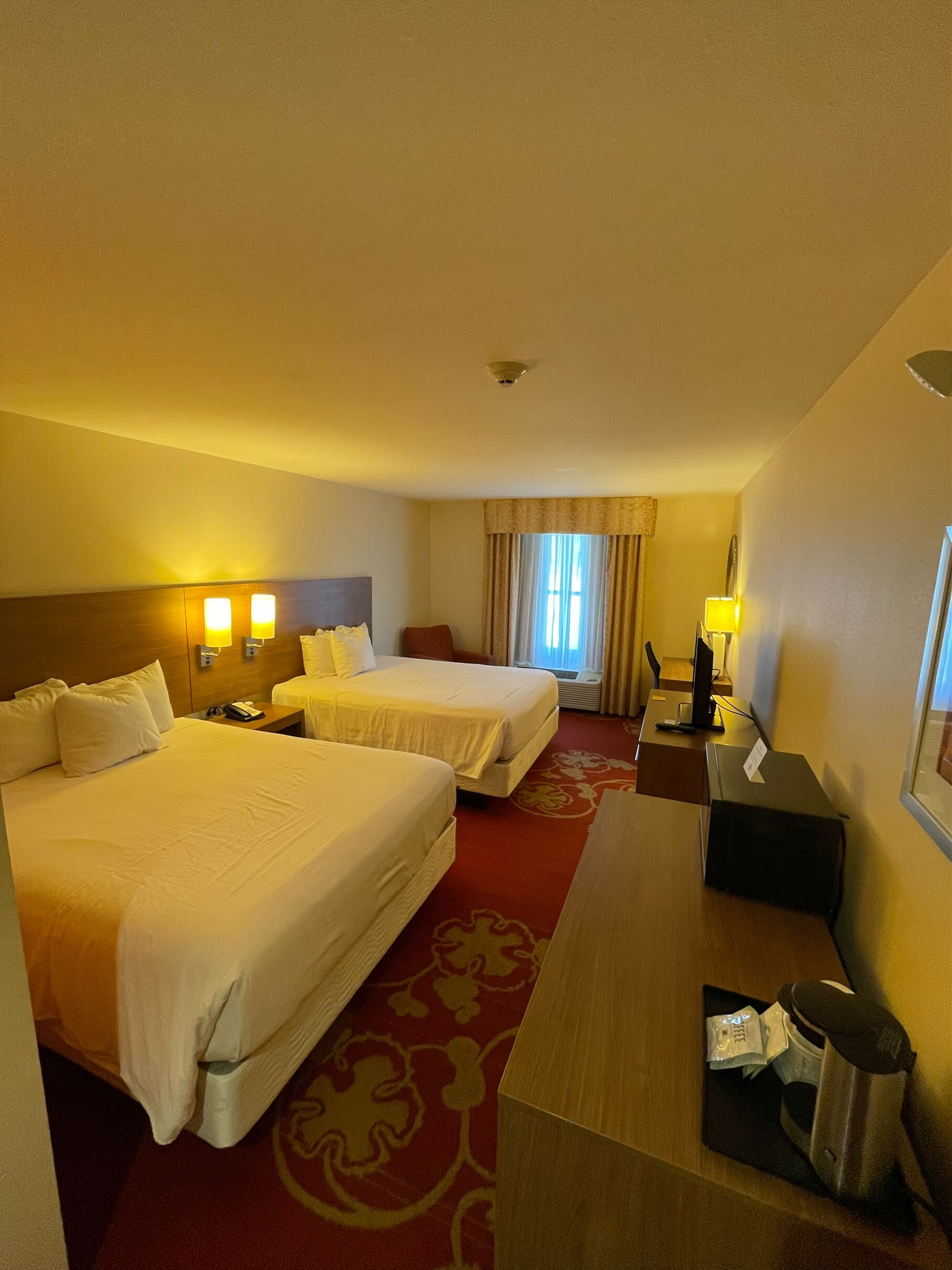 Desk, laptop workspace, iron/ironing board, free cribs/infant beds