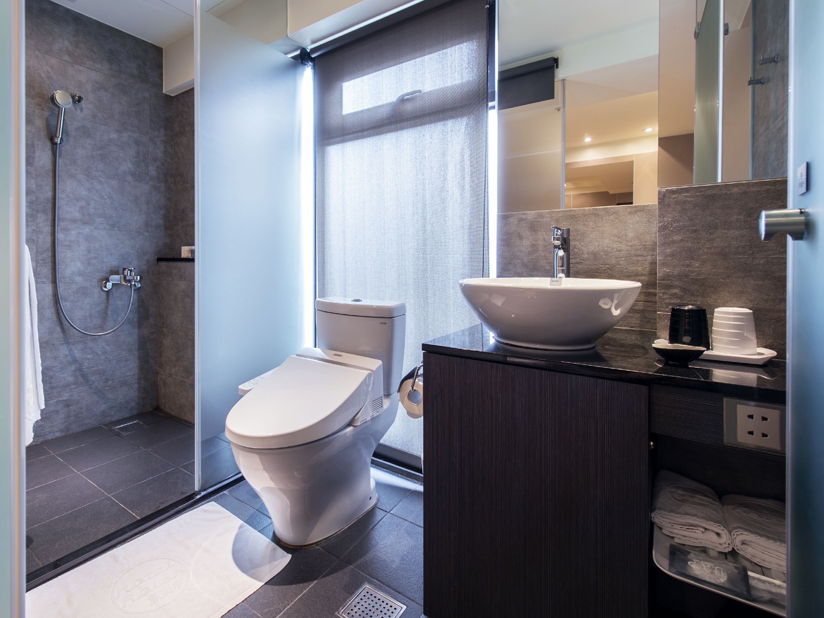 shower, hair dryer, slippers, bidet