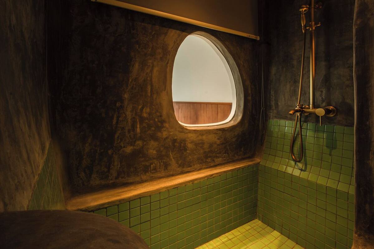 rustic twin room ocean view | bathroom | eco-friendly toiletries, hair dryer, slippers, bidet