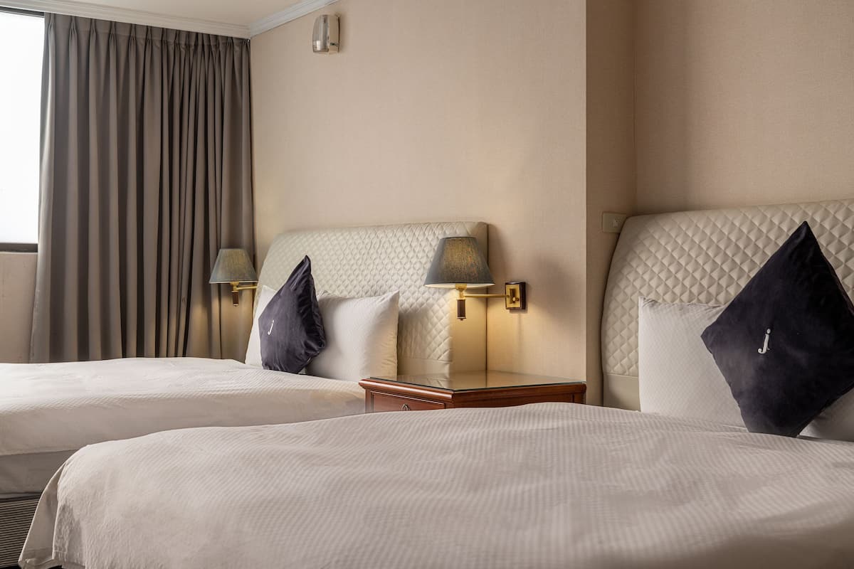 Hypo-allergenic bedding, down comforters, desk, blackout drapes