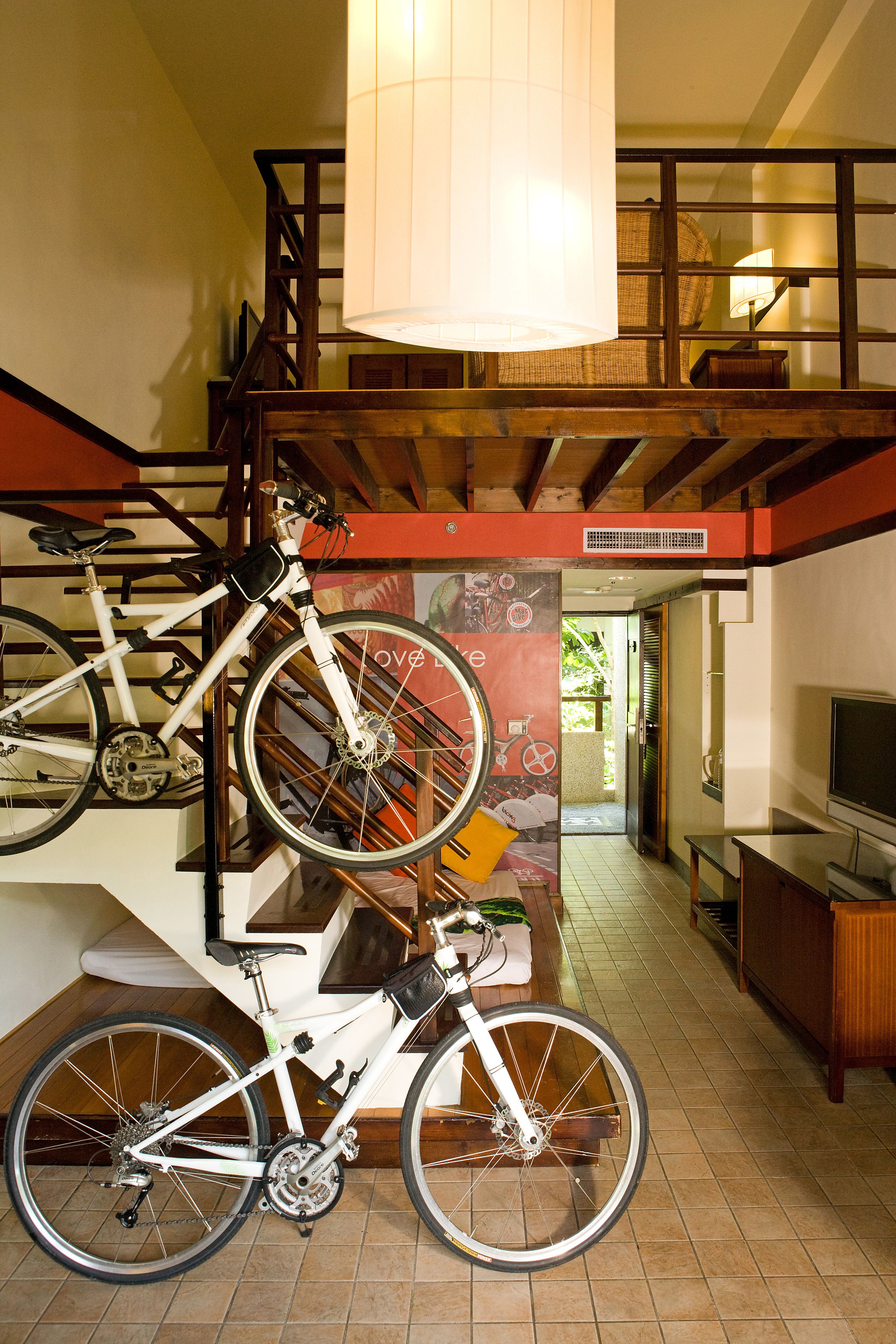 A staircase with a bicycle rack holding two bicycles.
